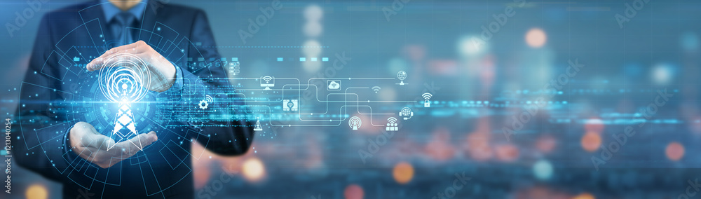 Businessman holding telecommunications equipment, mobile network ...