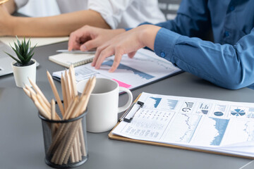 Fototapete - Data analysts team of office worker collaborate on business intelligence BI dashboard to analyze financial, trend, and marketing data. BI software utilization drive business success. Prudent