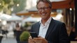 © Alexander Chaykin - Smiling Businessman on Phone