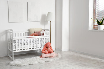 Wall Mural - Interior of light children's bedroom with baby crib, lamp and toy