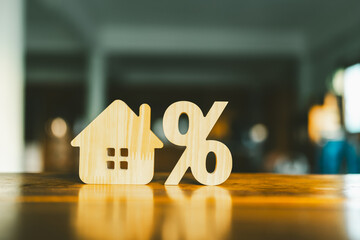 Wall Mural - Percentage and house sign symbol icon wooden on wood table. Concepts of home interest, real estate, investing in inflation.