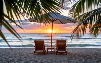 Wall Mural - A tranquil beach scene at sunrise with two wooden lounge chairs positioned under a white umbrella.