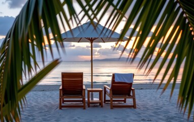 Wall Mural - A tranquil beach scene at sunrise with two wooden lounge chairs positioned under a white umbrella.