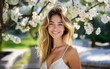 © Volodymyr - Beautiful girl. Happy woman portrait outdoor. Spring blossom background. Portrait of beautiful smiling woman with flowers. Woman face. Perfect natural skin.