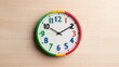 © Giman - Colorful clock on wooden wall, time management concept, office background, website design