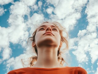 woman looks up at sky