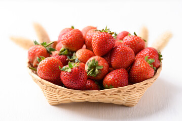 Wall Mural - Strawberry fruit in basket on white background