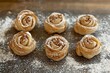 © natalia - Six delicious rose-shaped pastries topped with walnuts and powdered sugar, freshly baked on a rustic baking sheet.