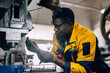 © Quality Stock Arts - african black male worker working in heavy metal industry factory punching stamping steel machine