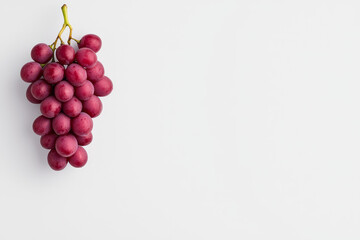 Aufkleber - A minimalist photograph of a single grape hanging from a thin vine against a stark white background, highlighting its natural beauty and simplicity,