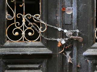 Rusty lock on a weathered door