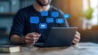 © Kanimalia - Man Using Laptop with Digital Communication Icons Emails Messages Online Communication Digital