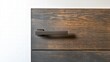 © Andrew - Sleek Black Door Handle on Dark Wood:  A close-up shot of a contemporary black door handle mounted on a rich, dark wooden panel.