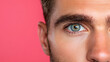 © siraphol - Close up of man face showcasing striking blue eyes and defined features
