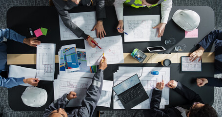 Aufkleber - Top Down View of Diverse Team of Business Professionals and Engineers Working Together on Architectural Plans in a Corporate Office. Focused Colleagues Using Laptop, Tablet, Blueprints and Documents.