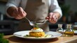 © Valentina - Chef plating açorda with poached egg and fresh parsley in modern kitchen setting