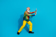 © deagreez - Full size photo of funny stylish aged man push empty space isolated on blue color background