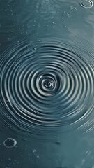 Poster - Concentric circles spreading across a tranquil teal water surface, creating a mesmerizing pattern filled with small bubbles and gentle reflections, evoke a sense of calm and serenity