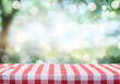 © Gustav - Red Gingham Tablecloth on Blurred Nature Background