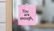 © JP STUDIO LAB - A simple but impactful photo of a sticky note on a mirror that says, 'You are enough,' encouraging self-love