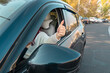 © Daniel - Positive Vibes on the Road: A Female Driver's Thumbs Up for Joyful Driving Experiences