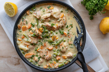 Wall Mural - Easy homemade one pan creamy chicken breast with vegetables in a frying pan