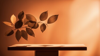 Wall Mural - Leaves casting a soft blur on the surface of the orange studio podium. A podium for an advertising photo on the background of an orange wall.