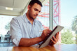© freechoice - Businessman using stylus pen while working on digital tablet in modern office