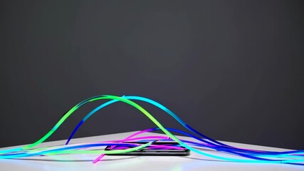 Poster - Dynamic light animation emerging from smartphone with vibrant neon colors in a dark setting