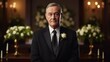 © Soba - Elderly caucasian male in formal suit attending event with floral background National Funeral Director and Mortician Recognition Day