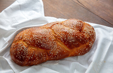 Easter sweet bread, homemade tsoureki braid on white table cloth