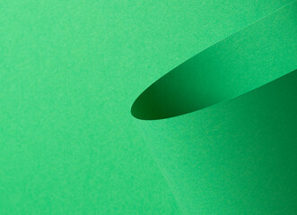Poster - Eden green paper background with a smooth matte finish and curled, cylindrical shapes. Vivid, saturated tones and a bold, geometric design create a dynamic, elegant, and contemporary composition with