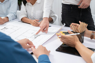 Poster - Diverse group of civil engineer and client working together on architectural project, reviewing construction plan and building blueprint at meeting table. Prudent