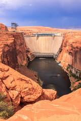 A large dam is built on a river in the desert