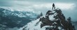 © Coosh448 - Solitary hiker on snowy mountain peak with vast winter landscape
