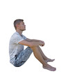 © psychoshadow - Pensive young man seated down looking up isolated over transparent background. Side view full length portrait thoughtful boy sitting