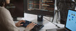 © Urbanscape - Young adult Asian female software developer coding program on desktop computer. Woman work from home, remote working, freelance programmer job, smart digital nomad lifestyle concept. Close Up
