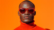 © Daniella - Portrait of Man Wearing Red Sunglasses and Orange Sweater