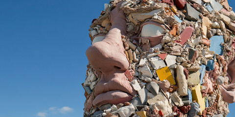 Wall Mural - Clay Sculpture Face Embedded with Multicolored Fragments