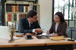 © aekachai - Lawyer or judge consult having team meeting with client, Law and Legal services concept