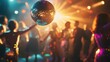 © Aditya - Disco ball in focus with blurred partygoers dancing in a nightclub. Warm lighting and vibrant atmosphere. Festive celebration.