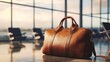 © averroes - Stylish leather duffel bag on shiny airport floor waiting for departure