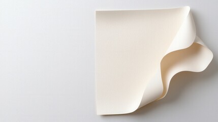 Wall Mural - Close up of a piece of paper with a curved corner on a wooden surface