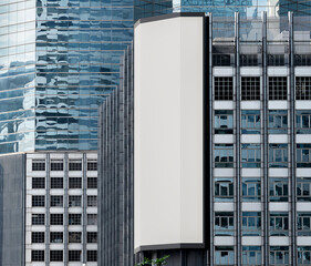 Wall Mural - Gray vertical large LED display billboard on building with cityscape background