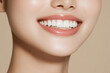 © Keopaserth - close up of woman smile showcasing bright, white teeth and smooth skin. image conveys sense of happiness and confidence, highlighting beauty of radiant smile