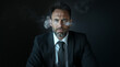 © Edgars - Businessman with a commanding presence expresses determination and intensity while smoke swirls in a dark atmosphere