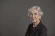 © alisaaa - Studio portrait of a senior woman posing against a grey background