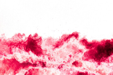 Wall Mural - red powder explosion cloud on white background. freeze motion of red color dust particles splashing.