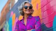 © Design By Reiga - Stylish woman, urban background, colorful mural, confident pose, lifestyle imagery