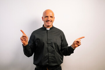 Priest pointing to the sides on white background.